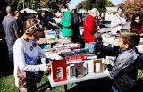 Local book enthusiasts, including these two youths, look for good reads at Saturday's (Oct. 12) Bi-annual Kings County Book Sale held at the Lemoore Library.